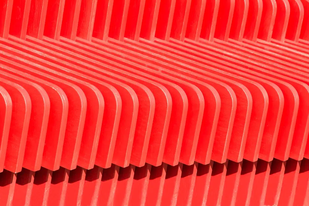 Red Background Of Repeating Parallel Lines.